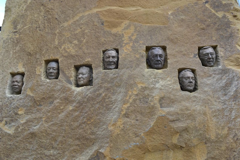 Close up details of the faces of real miners in the miners memorial in Doncaster town centre