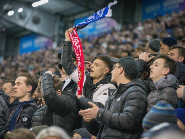 Pompey fans cheering on their side at Fratton Park.