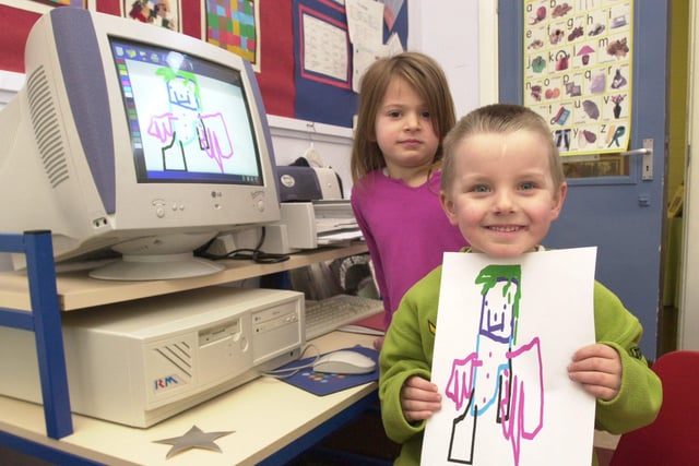 Pupils at Holt House Infants school, Bannerdale Road, Sheffield, where the school received three new computers thanks to the local Education Action Zone. Seen is Jake Hodges age 4, and Feya Boyle age 4 with  a print out of the picture they produced from the computer in February 2001