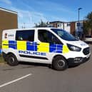 File picture shows a police van in Batemoor attending an incident in the past. Officers have described injuries suffered by a woman in an incident involving a gun this week.