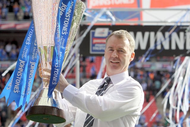 John Sheridan lifts the JPT trophy at Wembley in 2012 after victory against Swindon Town.