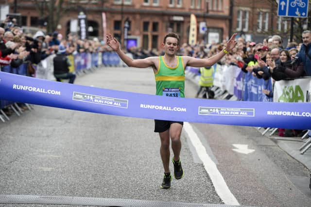 Shaffield Half Marathon 2022 is coming up in March - Jamie Hall winner of the Sheffield Half Marathon 2019 crossing the line on Pinstone Street.