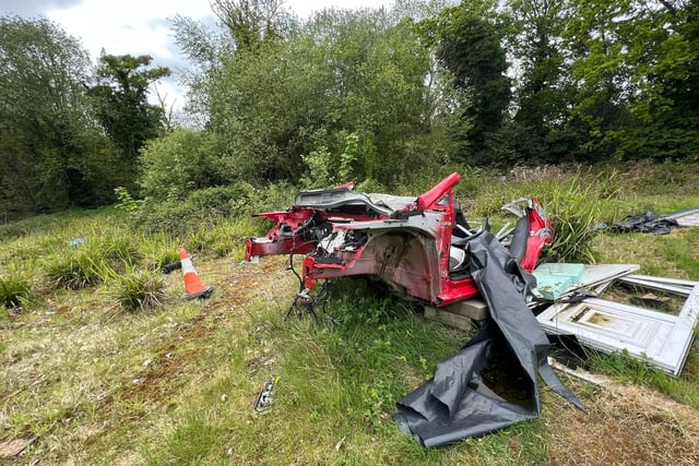 The wreckage of a car is among the rubbish littering the grounds of the once grand Victorian mansion Claremont House in Sheffield's Loxley Valley (pic: LKUrbex)