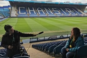 Star reporter Julia Armstrong being interviewed by film-maker Laura Page for a Stoppage Time film on the history of women's football