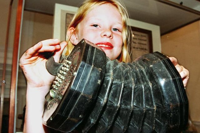 Nine year-old Ellie May Holland back in 1997. Holding an Concertina - part of the museum's exhibition.