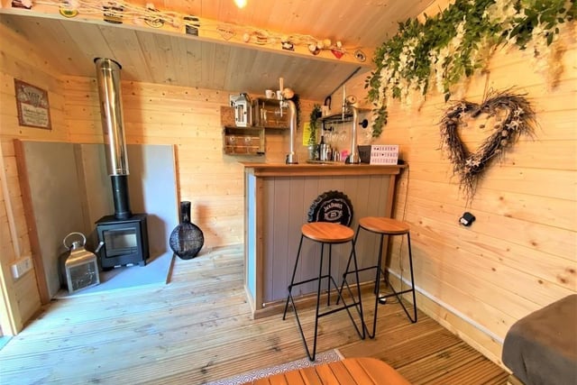 This is the bar located at the bottom of the garden. It's small, but brilliantly equipped to fulfill your home bar needs. A lovely touch.