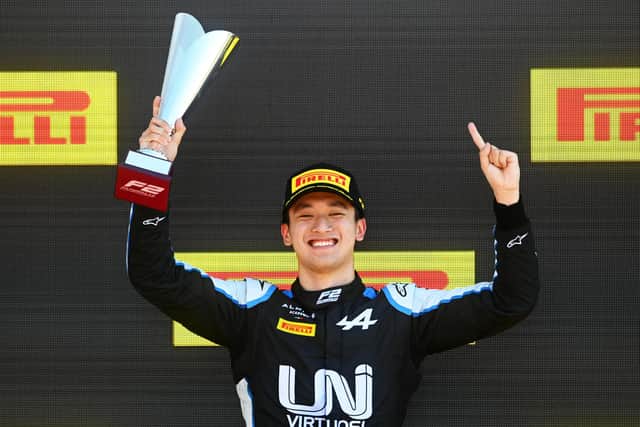 Guanyu Zhou celebrates a podium finish in the Formula 2 Championship at Silverstone in 2018 (photo by Michael Regan/Getty Images).