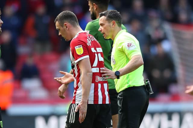 Referee Dean Whitestone ushers Filip Uremovic of Sheffield United off the pitch during the draw with AFC Bournemouth: Simon Bellis / Sportimage