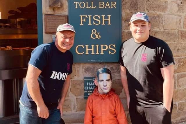 Toll Bar Fish and Chips owner Pete Grafton (left) with his son Harry (right) and in the middle is six-year-old Hayden Normi - or is it Tom Cruise?!