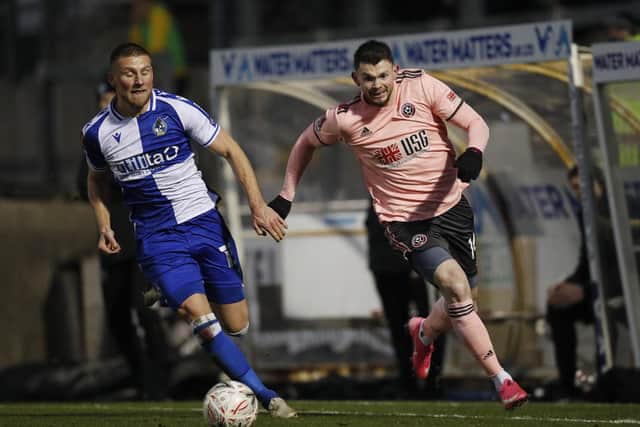 Alfie Kilgour of Bristol Rovers is passed by Oliver Burke of Sheffield United during the FA Cup match at the Memorial Stadium, Bristol. Picture date: 9th January 2021. Picture credit should read: Darren Staples/Sportimage