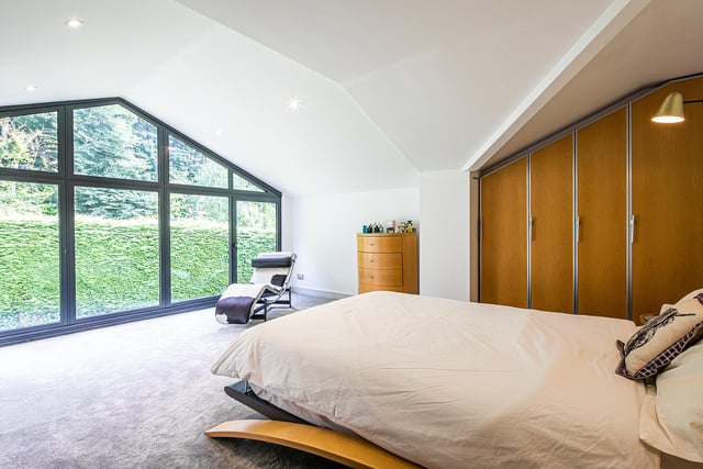 There are seven bedrooms spread over the upper floors. The estate agent says the property's annexe allows 'the opportunity for families to co-habit with dependent relatives or older children'.