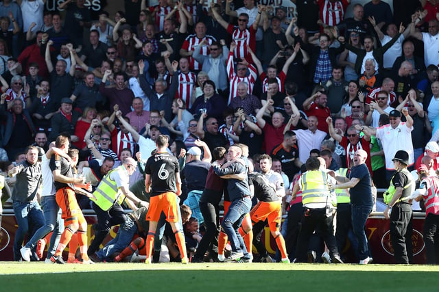 Sheffield United fans invade the pitch after leon Clarke had scored his sides first goal during the Sky Bet League One match between Northampton Town and Sheffield United at Sixfields on April 8, 2017 in Northampton, England.  (Photo by Pete Norton/Getty Images)