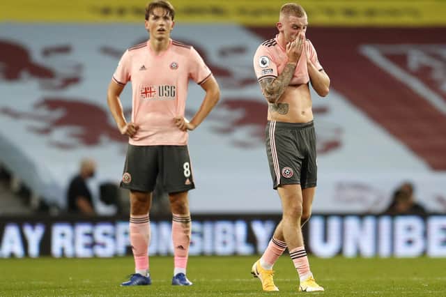 Oli McBurnie and Sander Berge react at the final whistle at Villa Park: Darren Staples/Sportimage