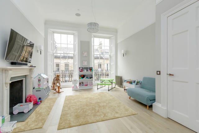 This property has three reception rooms, and this one is currently being used as a playroom. Each reception room benefits from the previously described integrated TV and ceiling speakers connected to a wireless Sonos system.