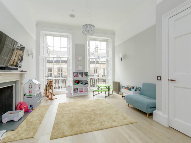 This property has three reception rooms, and this one is currently being used as a playroom. Each reception room benefits from the previously described integrated TV and ceiling speakers connected to a wireless Sonos system.