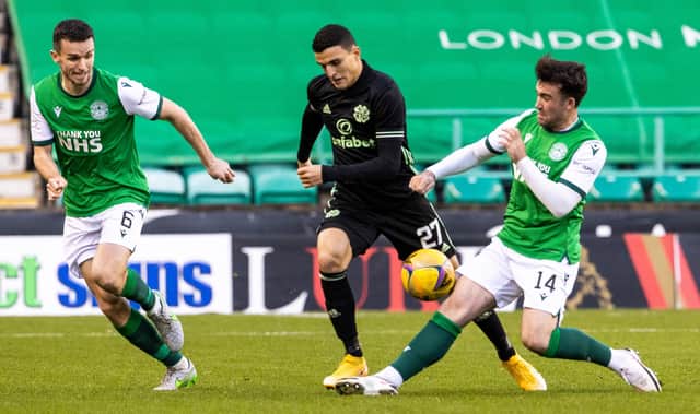 Hibs midfielder Stevie Mallan looks to stop Celtic's Mohamed Elyounoussi in his tracks