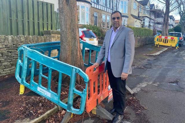 Coun Shaffaq Mohammed has been told that even temporary barriers on Dunkeld Road, placed around trees with bulging roots, are two years old.