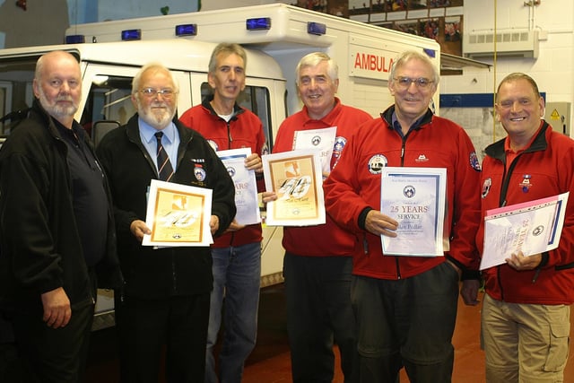 Buxton Mountain Rescue team long service awards, back in 2006, PDMRO chairman Mike France congratulates John Mayer and Ian Hurst - 40 yrs and Peter Parker, Alan Pedlar and Malcolm Bowyer 25 yrs