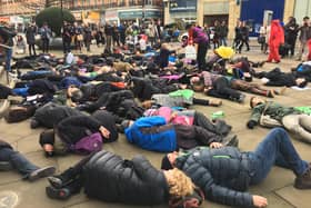 Protesters pretend to die outside Sheffield Town Hall to symbolise how the planet is suffering from climate change.