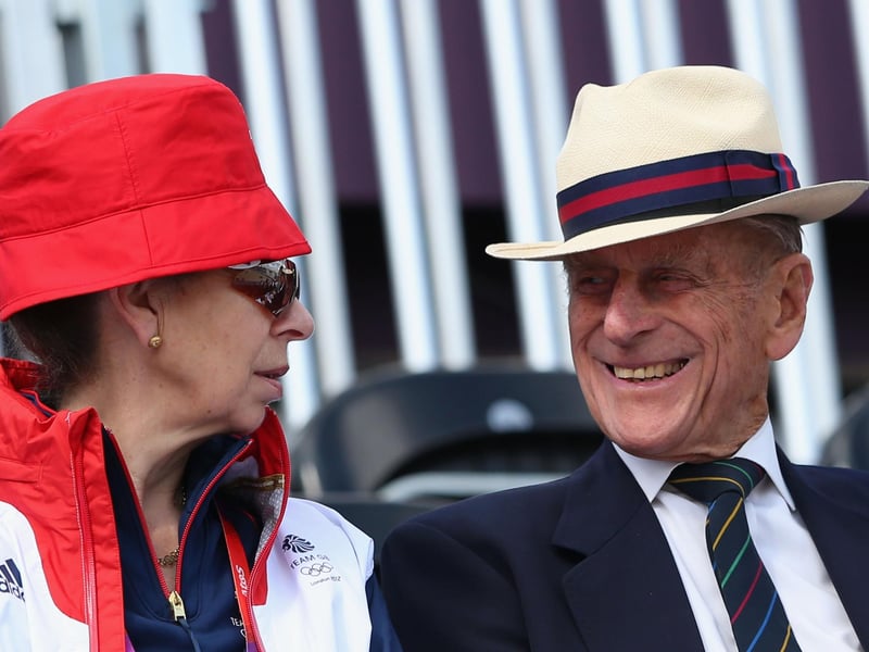 Princess Anne, Princess Royal and Prince Philip, Duke of Edinburgh smile on Day 2 of the London 2012 Olympic Games at Greenwich Park