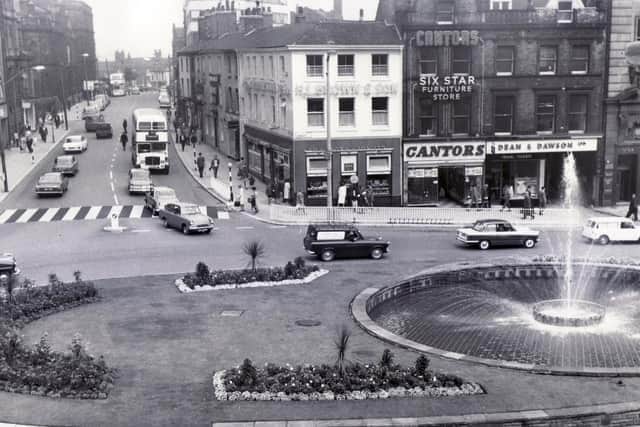 A view of the Goodwin Fountain and flower beds at the top of Fargate, taken from Sheffield Town Hall - 10th August 1967.