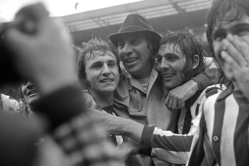 Sunderland manager Bob Stokoe is overcome by emotion as he hugs Dennis Tueart (left) and match winner Ian Porterfield seconds after the final whistle.