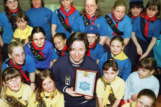 Victoria Betts, off the 11th Doncaster Guide Company, is pictured with her Queen's Guide Award. Looking on are fellow guides and brownies in 1998