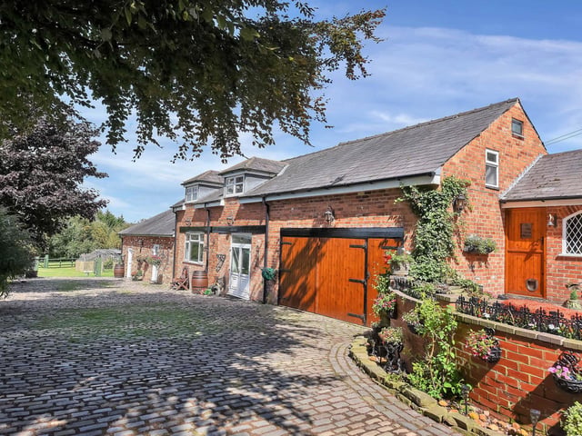 The grounds are entered via wrought iron gates and a sweeping cobbled driveway leads on to a substantial free standing parking area.