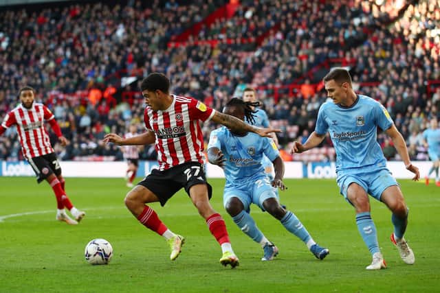 Morgan Gibbs-White of Sheffield United is challenged by Fankaty Dabo of Coventry City during the Sky Bet Championship match at Bramall Lane, Sheffield: Simon Bellis / Sportimage