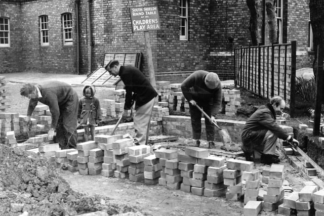 Members of the South Shields Round Table at work on the children's playground which they were constructing at South Shields General Hospital in 1963.