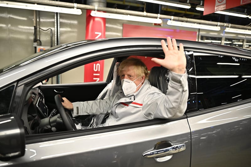Mr Johnson gets comfortable in a car while on a tour of the Nissan plant. Picture: Jeff J Mitchell/Getty Images.