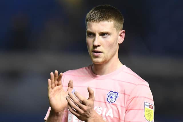 Cardiff City defender Mark McGuinness has joined Sheffield Wednesday on loan.