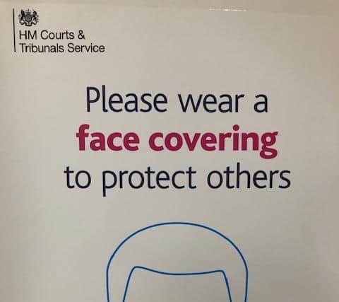 Picured is one of the many Covid-19 face covering warnings at Sheffield Crown Court.