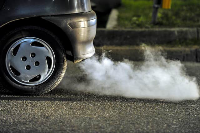 Car belching out exhaust fumes. Sheffield Council's Clean Air Zone won't be in place until 2023 'at the earliest'