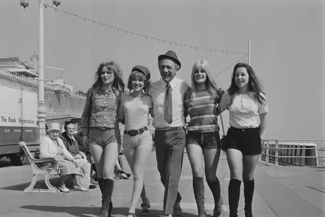 Sid James on the set of film 'Carry On at Your Convenience', with fellow actresses