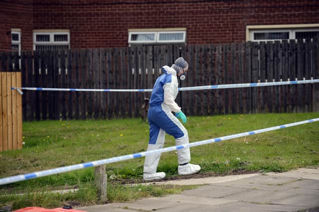 The forensic team arrives at Victoria Road on Tuesday.