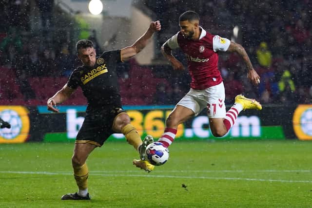Bristol City's Nahki Wells (right) and Sheffield United's Jack Robinson battle for the ball during the Sky Bet Championship match at Ashton Gate, Bristol: Adam Davy/PA Wire.