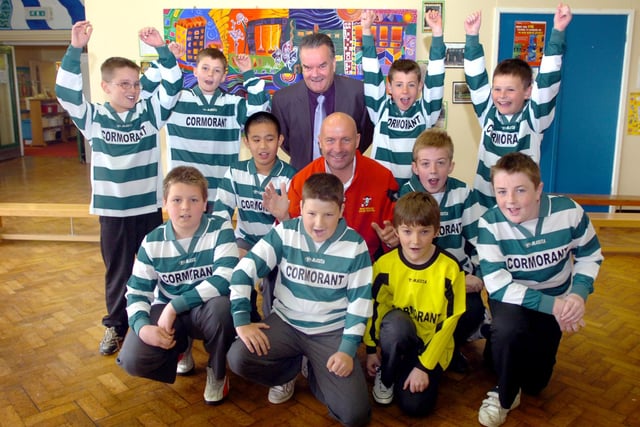These pupils looked delighted with this football strip donation 12 years ago. Does this bring back happy memories?