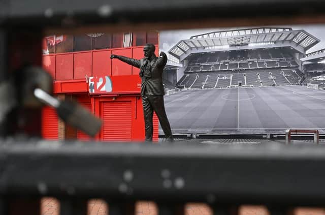 A picture shows the statue of Liverpool football club's late legendary manager Bill Shankly at Liverpool football club's stadium Anfield. Photo by PAUL ELLIS/AFP via Getty Images