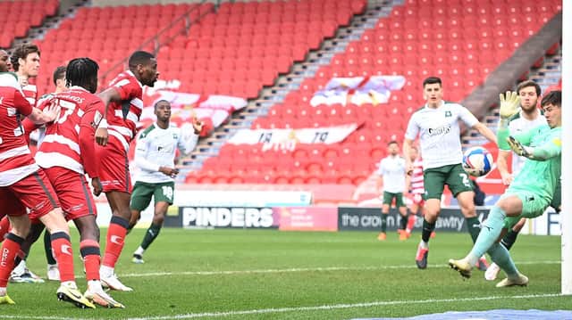 Omar Bogle heads in Rovers' second goal against Plymouth. Picture: Howard Roe/AHPIX