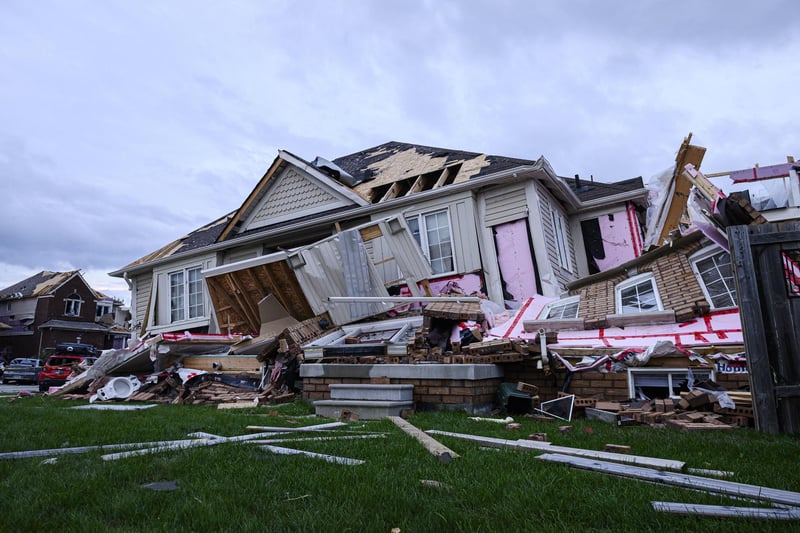 Damage left after a tornado touched down in a neighborhood of Barrie, Ontario, on Thursday, July 15, 2021. (Christopher Katsarov/The Canadian Press via AP)