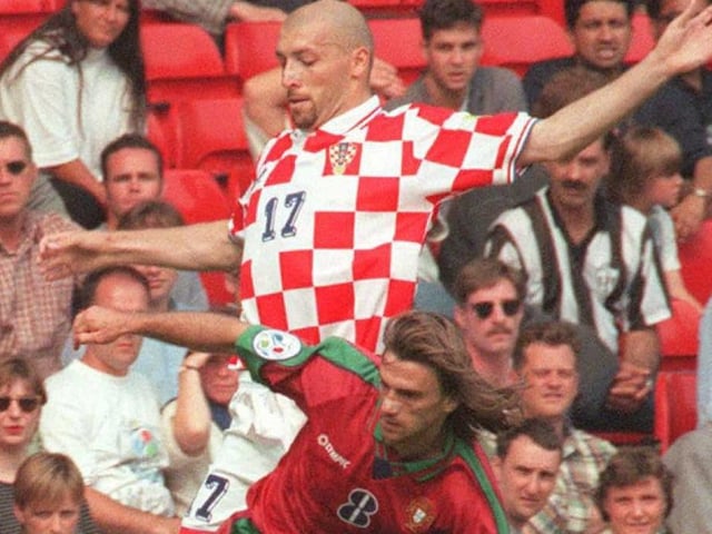 Igor Pamic of Croatia and Joao Pinto of Portugal battle for the ball during the early stages of the match between Portugal and Croatia.