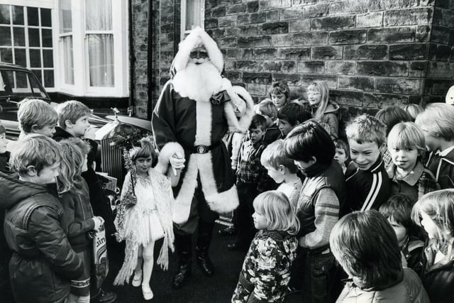 Father Christmas arrived by Rolls Royce to open the mini market in aid of Holy Trinity Millhouses Church Hall roof, which needs renewing on December 11, 1982