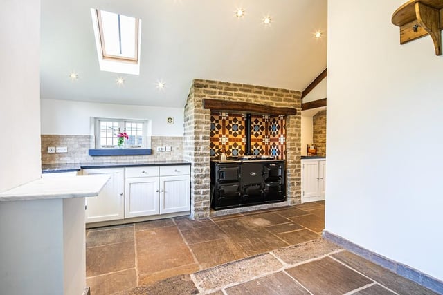The Aga - with its attractive tiled surround - is a focal point of the kitchen.