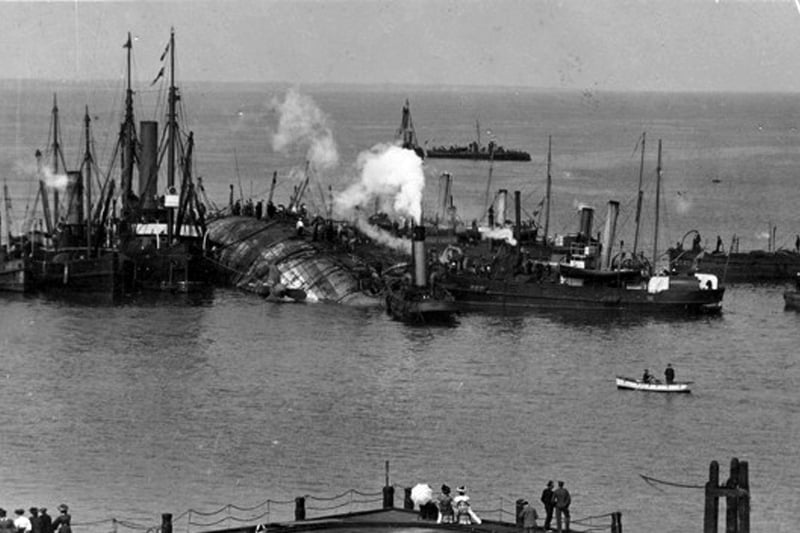HMS Gladiator passing Victoria Pier en-route to Portsmouth Dockyard.
Being assisted by tugs and associated vessels HMS Gladiator is assisted into Portsmouth Harbour. People watch on from Victoria Pier. 
HMS Gladiator Portsmouth-based cruiser and American steamer SS Saint Paul collided in a snowstorm off the Isle of Wight on April 25 in 1908. One officer and 28 men in total had died, most of them drowned. Strangely, the SS Saint Paul capsized and sank in New York Harbour on 25 April, 1918, exactly 10 years after HMS Gladiator sank. Picture: Paul Costen collection
