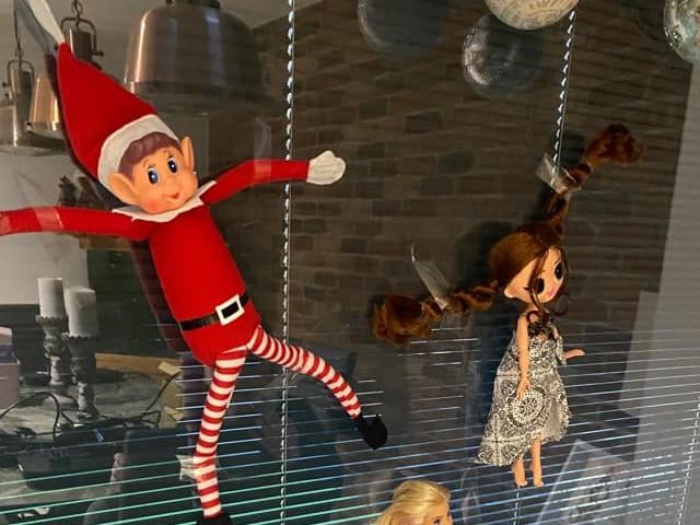 Angie Jones stuck the elf to the wall in a game of The Floor is Lava.