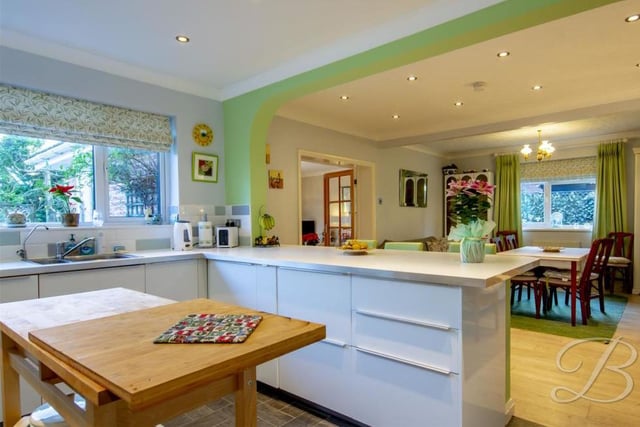 Sure to be the heart of the home, here is the open-plan kitchen and dining area from another angle. The kitchen includes a breakfast bar and inset sink with complementary work surface
