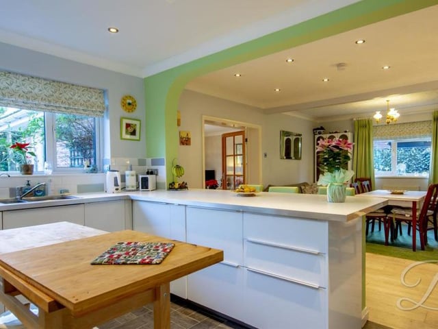 Sure to be the heart of the home, here is the open-plan kitchen and dining area from another angle. The kitchen includes a breakfast bar and inset sink with complementary work surface