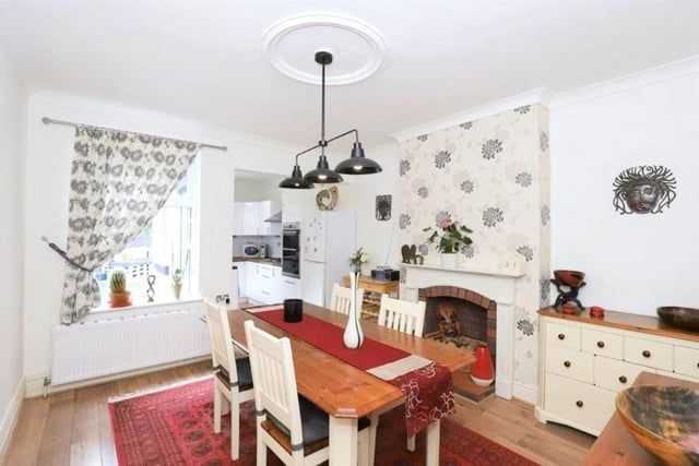 The dining room is very large, with ample room for hosting and potentially an even bigger table than the one in the photo. It's found right next to the kitchen, making it the perfect environment to cook whilst entertaining guests or watching the kids.

Photo: Rightmove