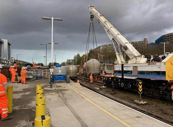Work is continuing to re,move the derailed train